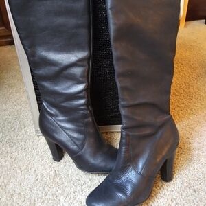 Black knee high heeled boots